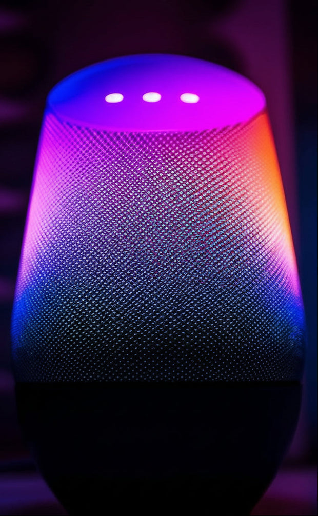 Smart home device with colorful gradient lighting on a dark background